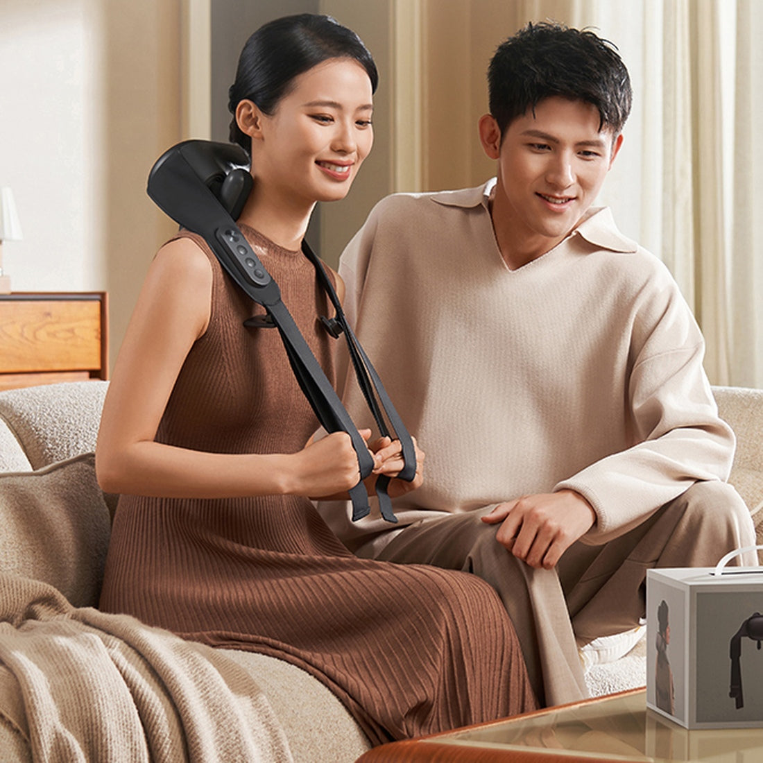 Xiaomi Mijia Smart Shoulder and Neck Massager worn at home, full unit and pull straps visible