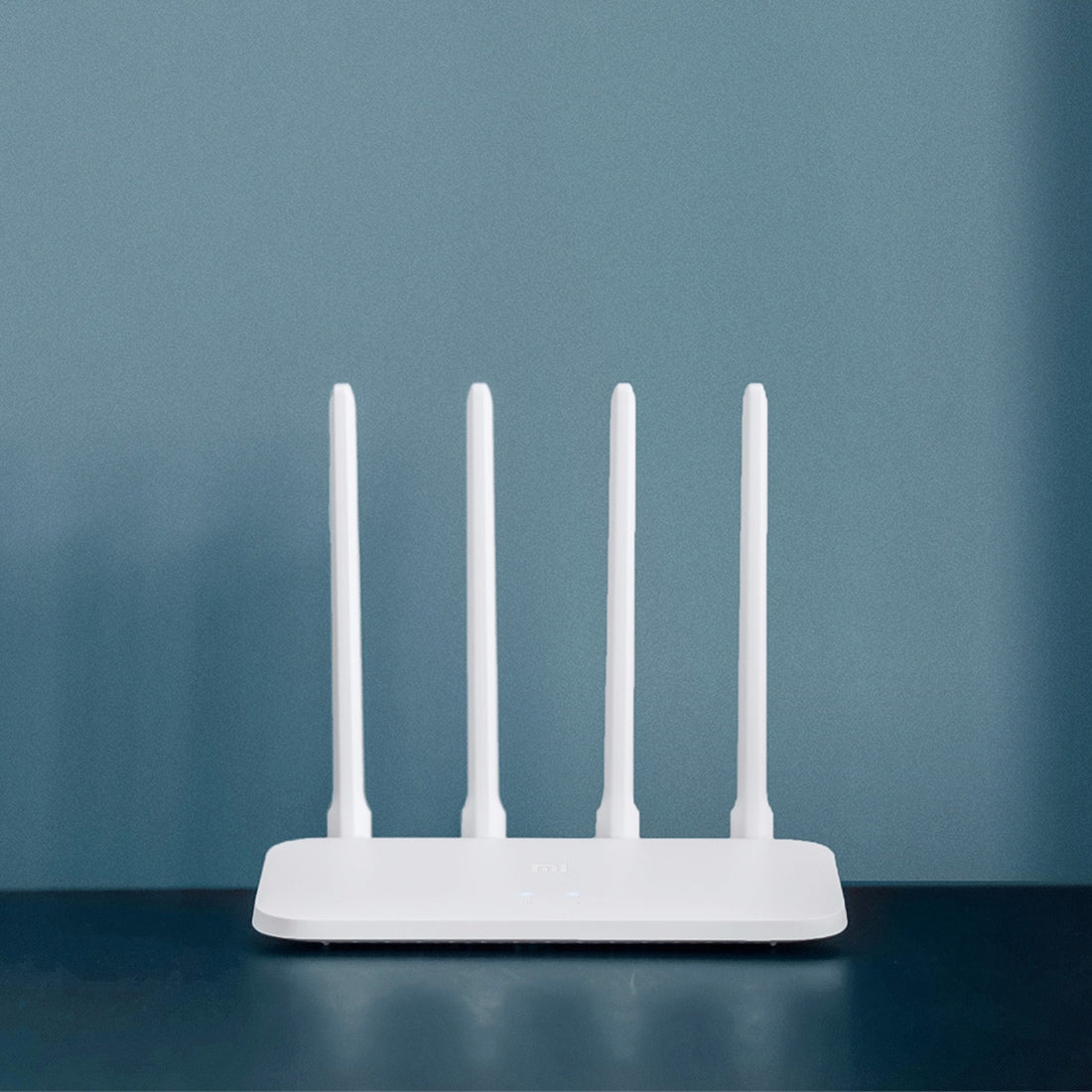 Xiaomi Mi Router 4A white router in a bedroom setup