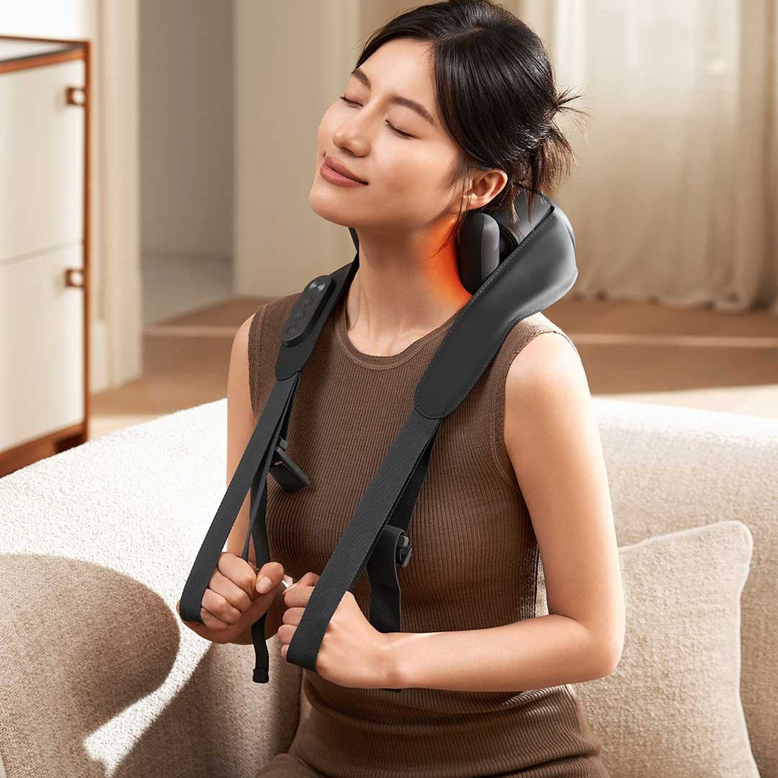 Xiaomi Mijia Smart Shoulder and Neck Massager worn with adjustable pull straps; manufacturer usage illustration