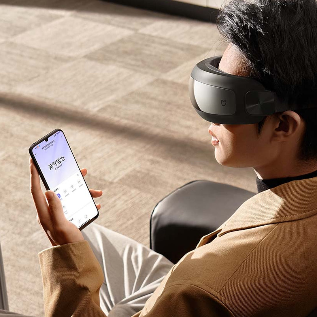 Xiaomi Mijia Smart Eye Massager worn at home, manufacturer illustration of app controls