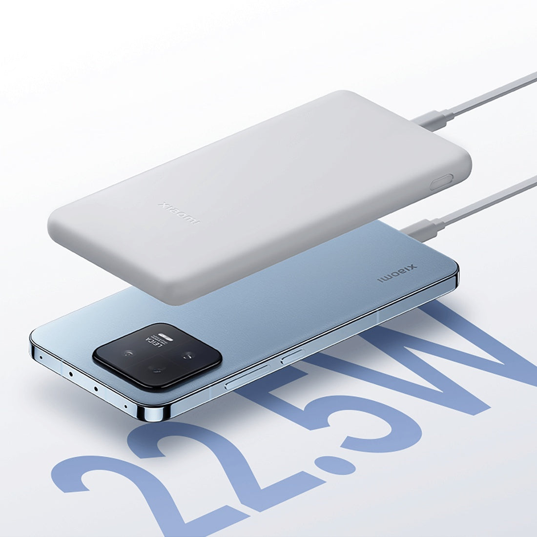 Xiaomi 22.5W Lite power bank with a compatible smartphone and charging cables