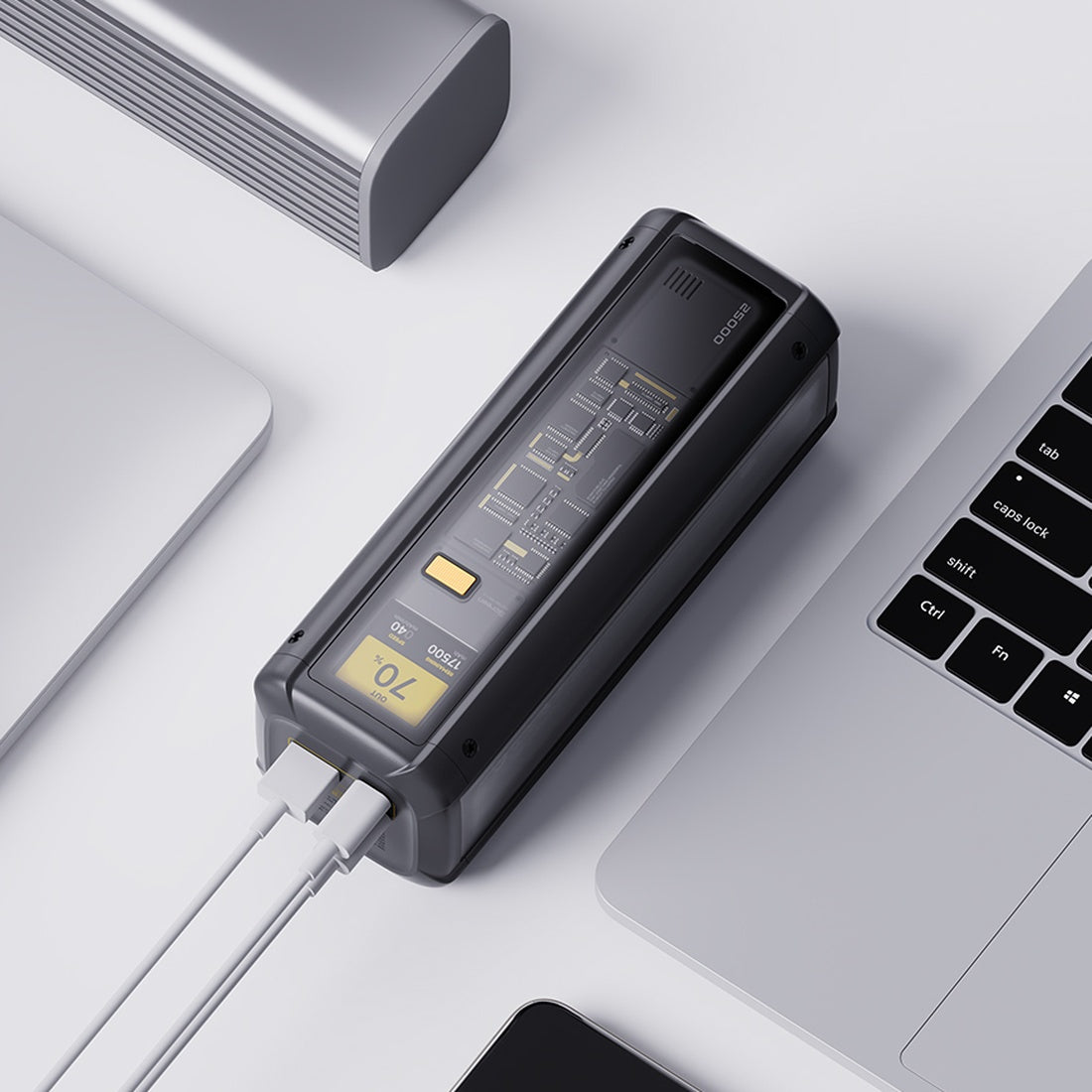 Xiaomi 25000mAh power bank connected to devices on a desk