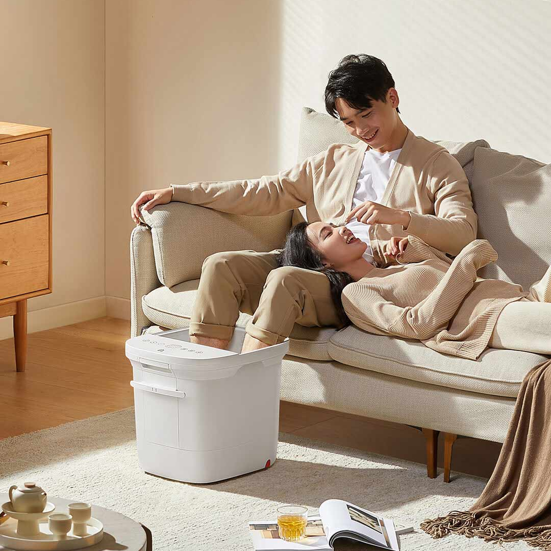 Xiaomi White foot bath beside an armchair