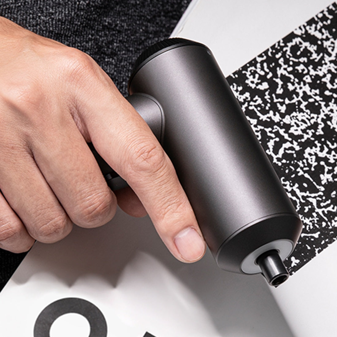 Mi Cordless Screwdriver held in one hand showing the trigger