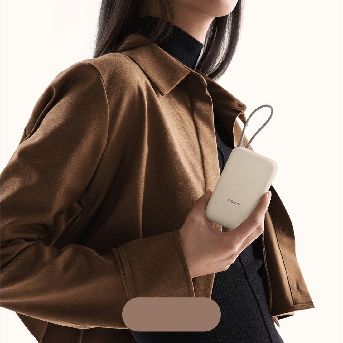 Xiaomi Power Bank 10000mAh Integrated Cable Tan held in hand