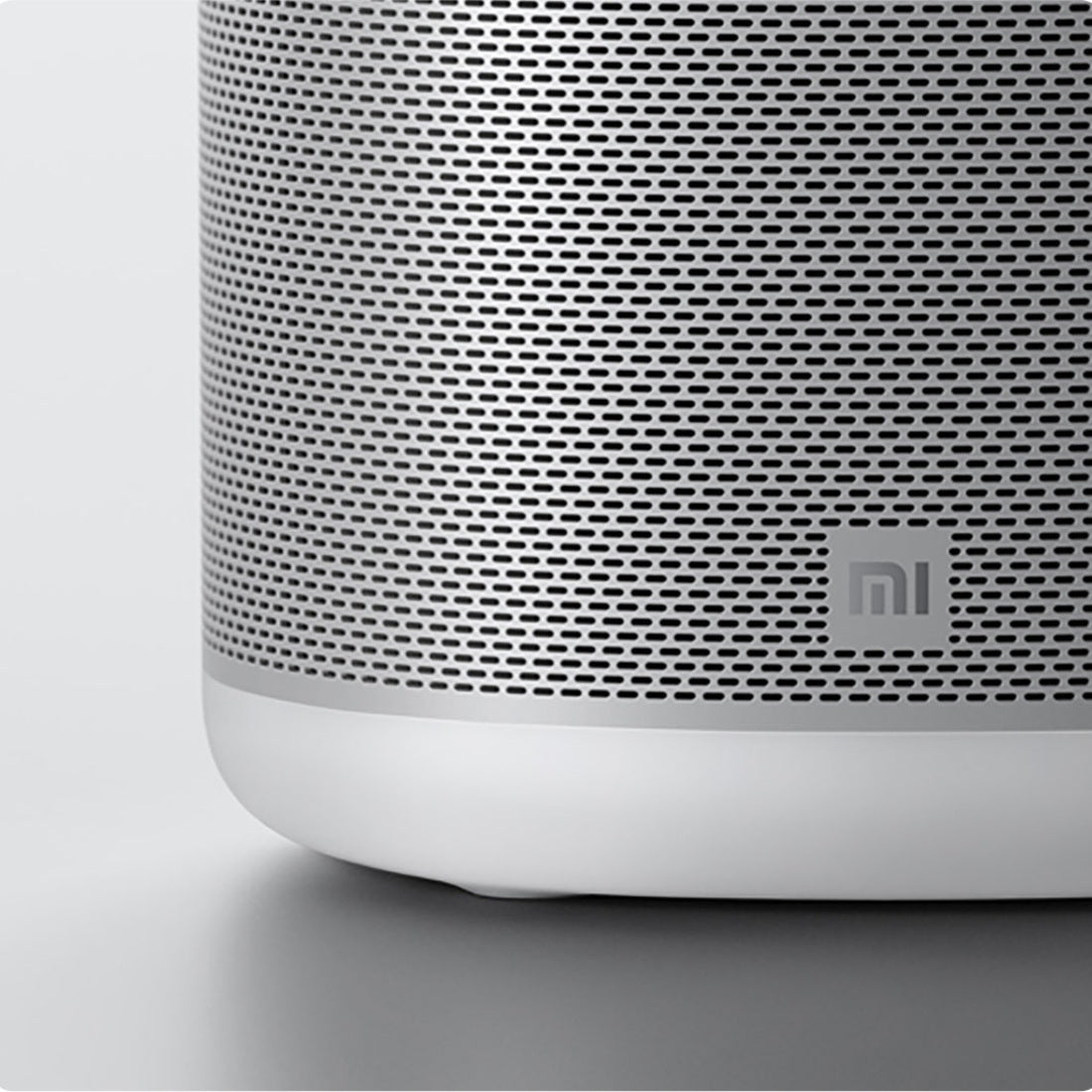 White Mi Smart Speaker metal mesh and Xiaomi logo detail