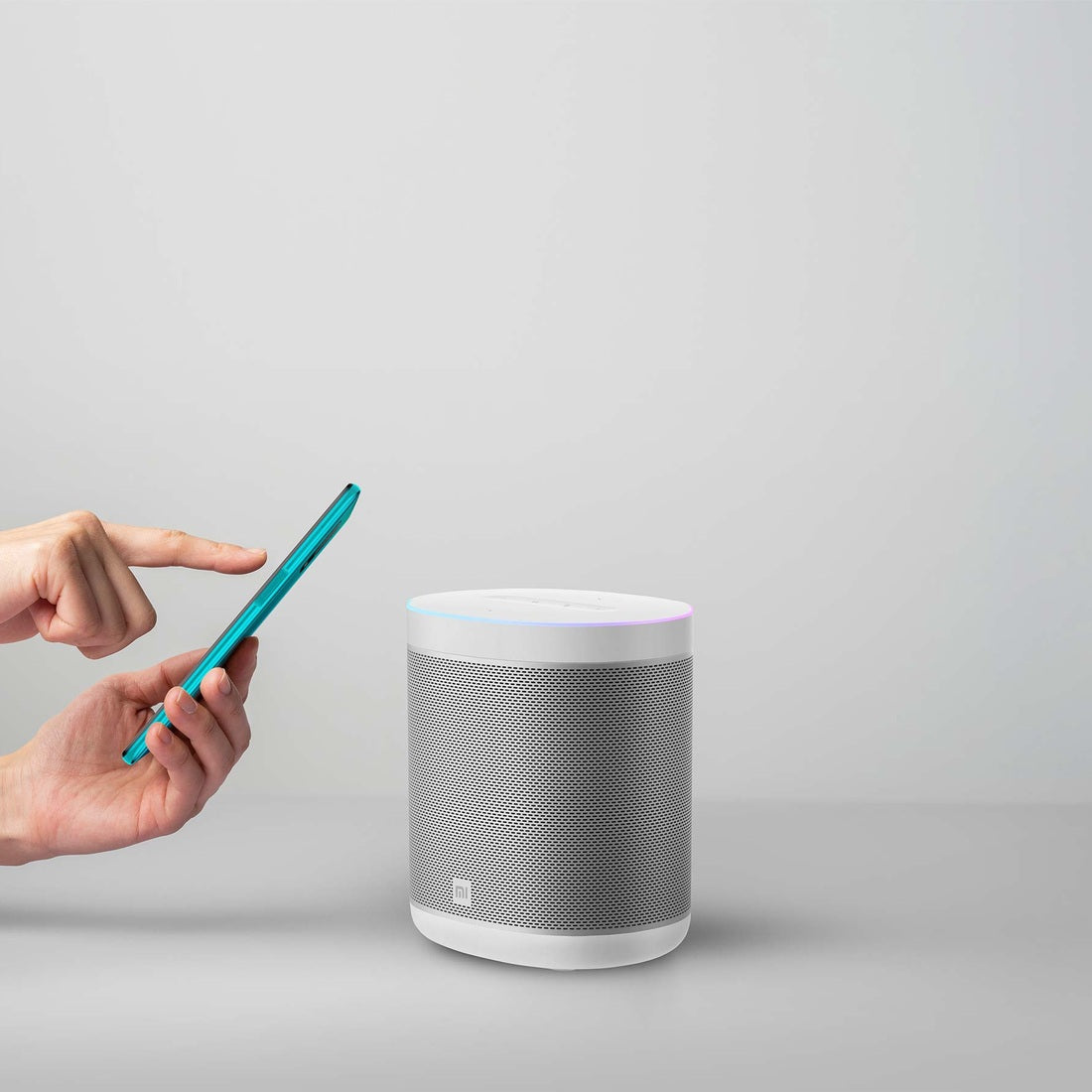 Mi Smart Speaker illustrating wireless playback from a smartphone